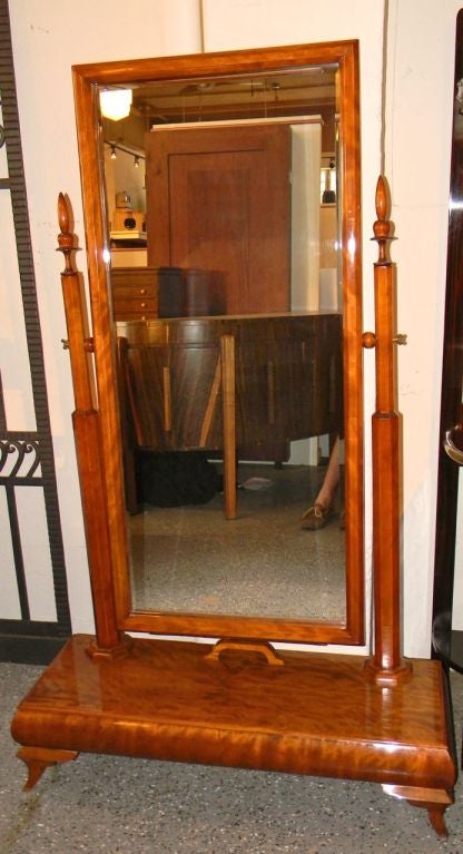 A wonderful and original wood stand up mirror. Great details with nice column details and carved wood. Beautifully flamed Honduras mahogany wood and lots of details. Would of course be great for a bedroom, dressing room or anyplace a nice Deco