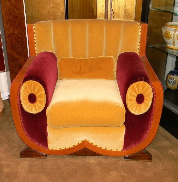 This is a custom made chair taken from an original set we once had. It is truly fit for a king. Very comfortable and slightly over-sized.  Beautiful mohair seating in both rich burgundy and creamy yellow. <br />
Great American movie theater kind of