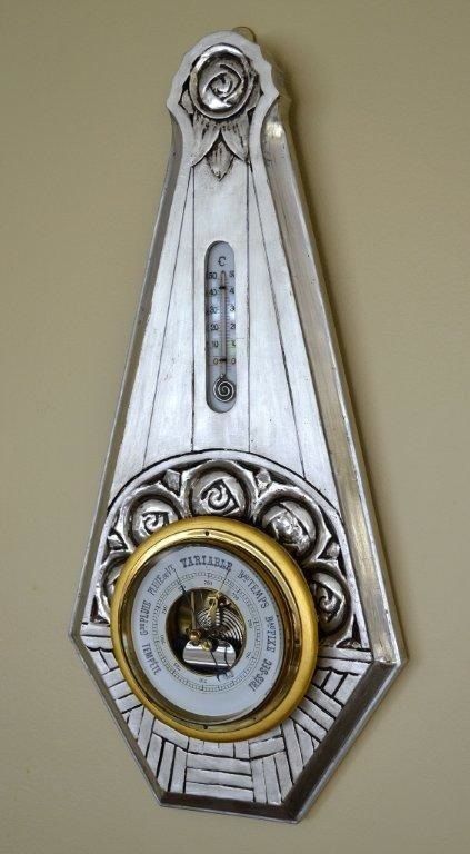 Beautiful French Art Deco barometer - thermometer. Carved wood covered with gesso and silver leaf with gold detail around the barometer.  Wonderful looking and adds so much to a period room.<br />
<br />
Measurements:<br />
<br />
22