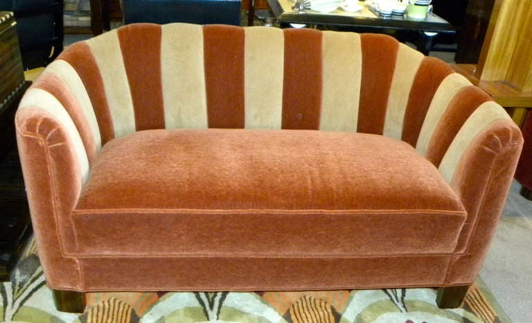Just completed this wonderful small channel backed two tone mohair sofa.  Great size and a great shape. I love the way it just wraps around and certainly two people could fit very comfortably in the nice settee.  The colors are a warm rust mohair