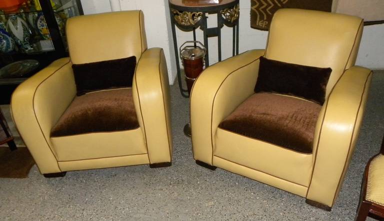 French style streamlined club chairs done in chocolate mohair and creamy yellow leather, that look and feel “Like Buttah!” Original Art Deco frames have been reupholstered completely to give you the nice balance of firm back support with a little