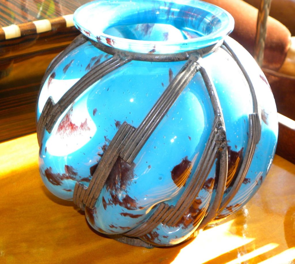 A wonderful example of Lorraine, Daum glass from this very limited period. A very unusual blue color all blown to fit this nice geometric shaped iron work. The glass has a translucent quality, and very nice size, French, circa