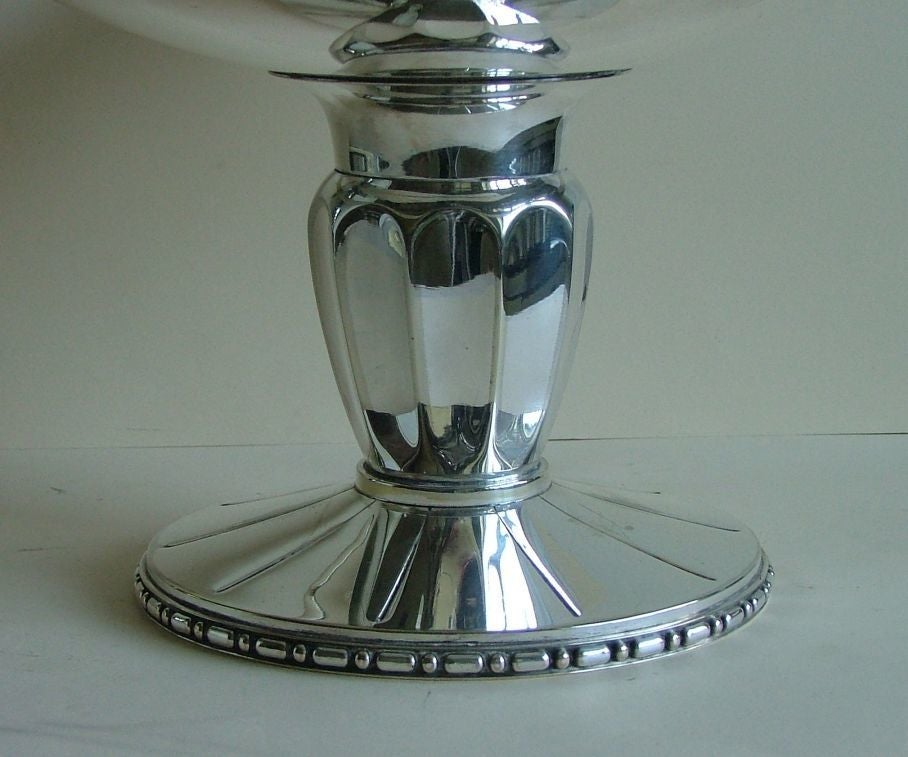 A wonderful serving piece, really big silver plated bronze Tazza. An amazing design with fabulous stepped ziggurat handles and other stylized decoration on a heavy fluted tapering column. Excellent condition all round with makers mark R*M for