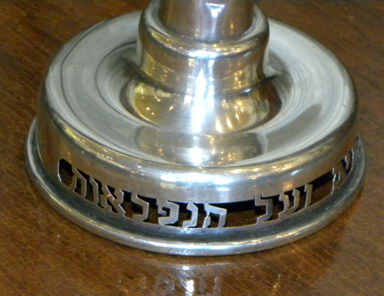 This is a  stunning Art Deco style Sterling Silver (not silver plated) Hanukkah lamp Menorah, from Israel , early 1950's. Old world hand made craftsmanship and an impressive size. The Menorah is set on a round base pierced with the Hebrew phrase Al