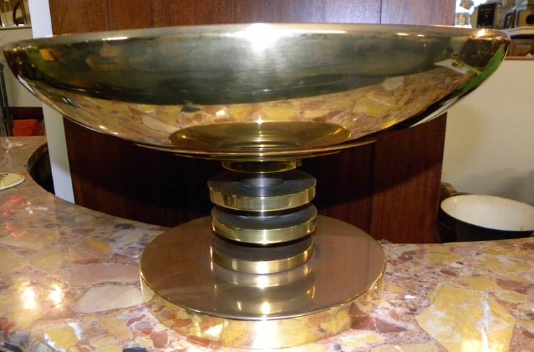 This stunning French tabletop torchiere gleams as the polished brass shows its powerful design. A substantial piece made of the highest quality construction in both execution and weight. Purchased in France, it shows great craftsmanship and style.