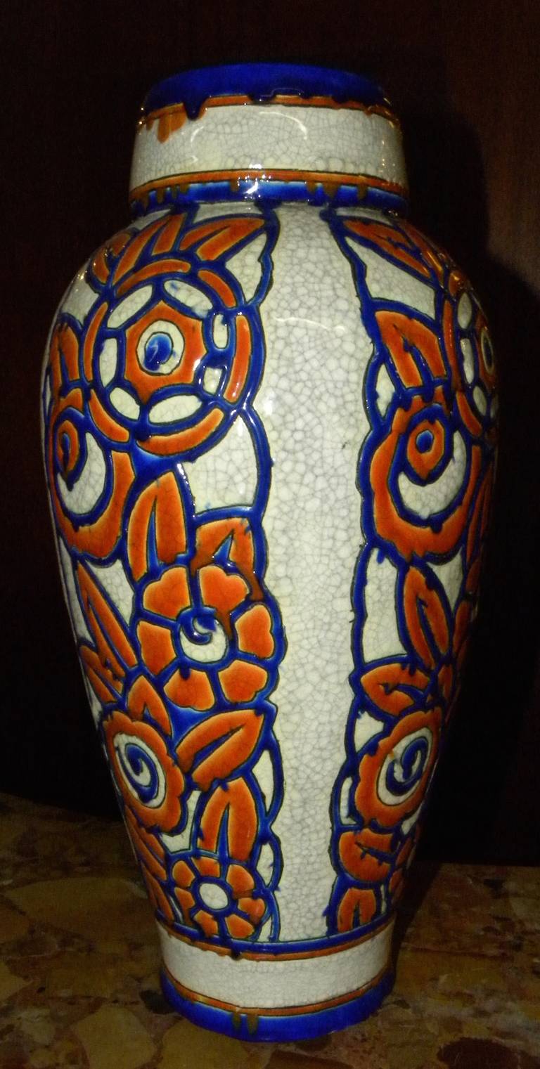 Large vase with unusual color treatment. Made by Boch during Charles Catteau era. Ceramic cloisonné with crackle background in strong blue and orange colors. Cloisonné is defined by colors contained by a line. You can see the handmade quality with