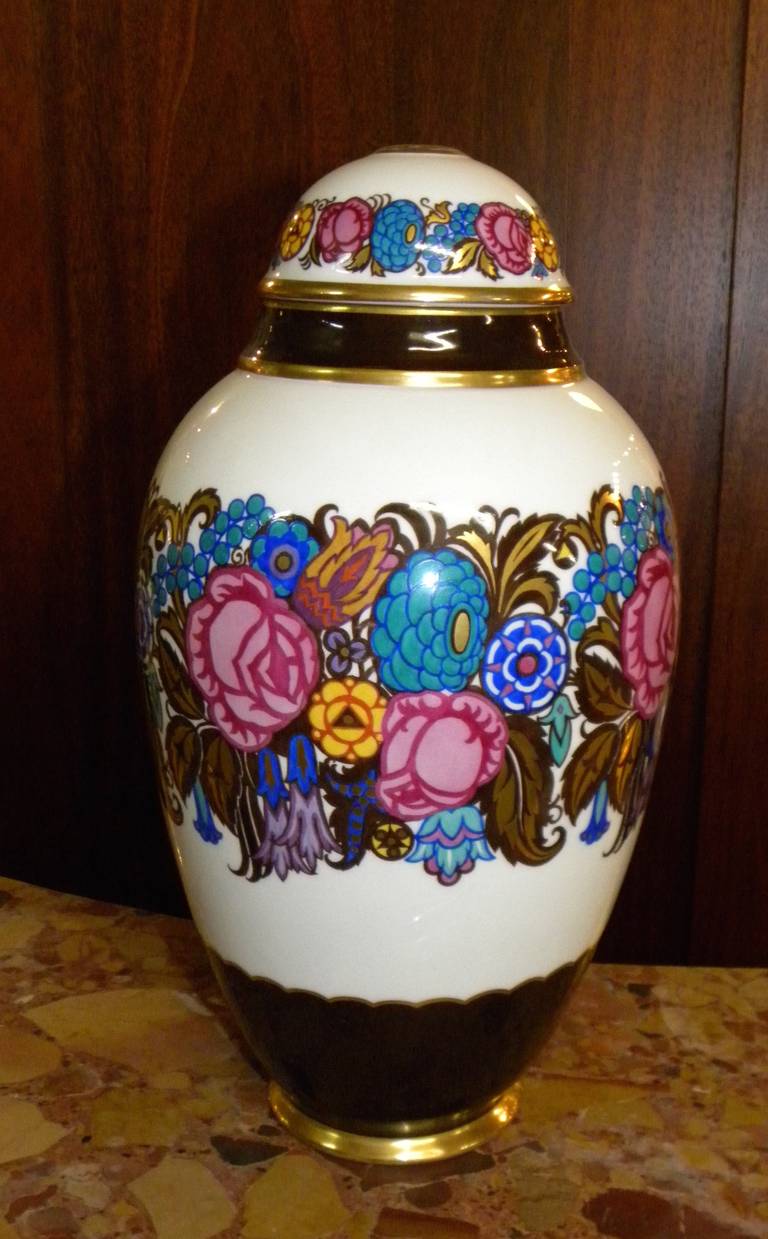This German porcelain jar with lid bears the stamp Lorenz Hutschenreuther, Selb, a Bavarian company with a long history dating all the way back to the parent company which was founded in 1814. An unusual example with a strong Art Deco point of view,