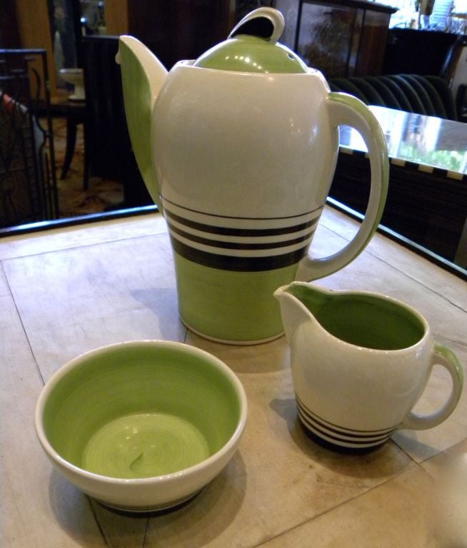 This is an exciting Susie Cooper, 15 piece set of the striking modernist china by one of Britain’s most re-known ceramicists and dinnerware designers. Green & Black Tea set with kestrel pot, sugar, creamer, six cups and six saucers.  Good with no