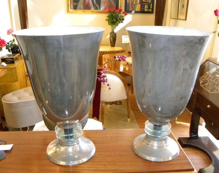 Nice original pair of nickel French torchiere lamps with streamline overtones.  All original, round disks, supporting the neck and large upscale lights.  I bought this wonderful pair years ago on a trip to France and had them stored for many years. 
