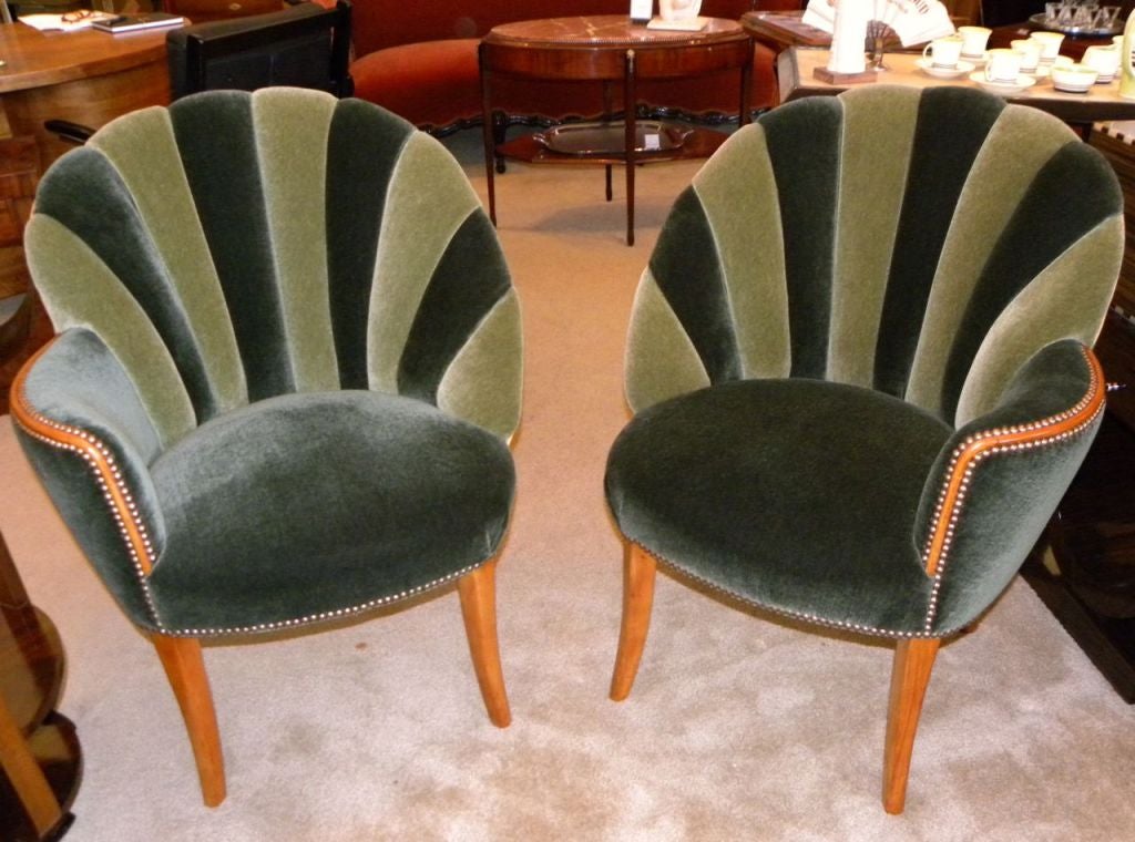 A wonderful newly restored vintage pair of Hollywood style channel backed chairs.  I just love these chairs.  So sophisticated, comfortable and elegant.  We restored the original wood and utilized some great looking two-tone green mohair to create