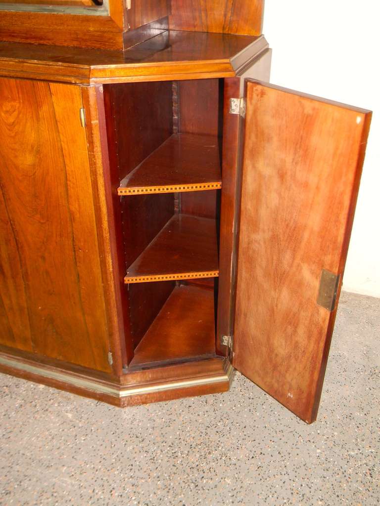 This is a wonderful original French cabinet. Wood with front storage and closed doors, plus a nice upper vitrine with beveled glass window and glass shelves. Great modernist metal work handle and a very useful piece of furniture. Make a great