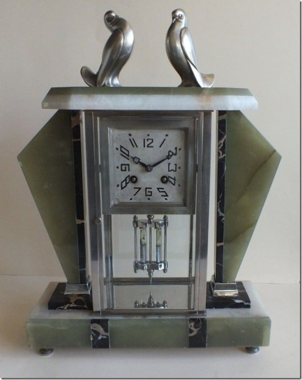 A stunning Art Deco clock with many fine details.  The clock was made circa 1930's and in many ways, is more interesting then the typical French wind up clocks from that period.  It is in immaculate condition.  

This piece was certainly designed 