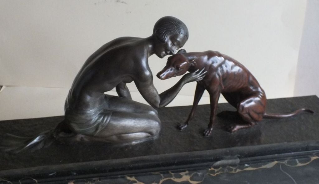 A large and superb French Art Deco bronze depicting kneeling nude young girl figure with her Borzoi dog by J. Lormier. Modeled as the young girl knelt down petting her dog, beautifully sculpted and cast in bronze with a silvered and cold painted