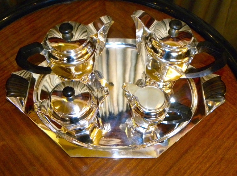 We have just completed the restoration of this classic Art Deco Coffee Tea service.  Beautiful design, wonderful condition with a great tray as well.  The pieces are marked Buenos Aires, but there is also a German mark on the side as well.  Most