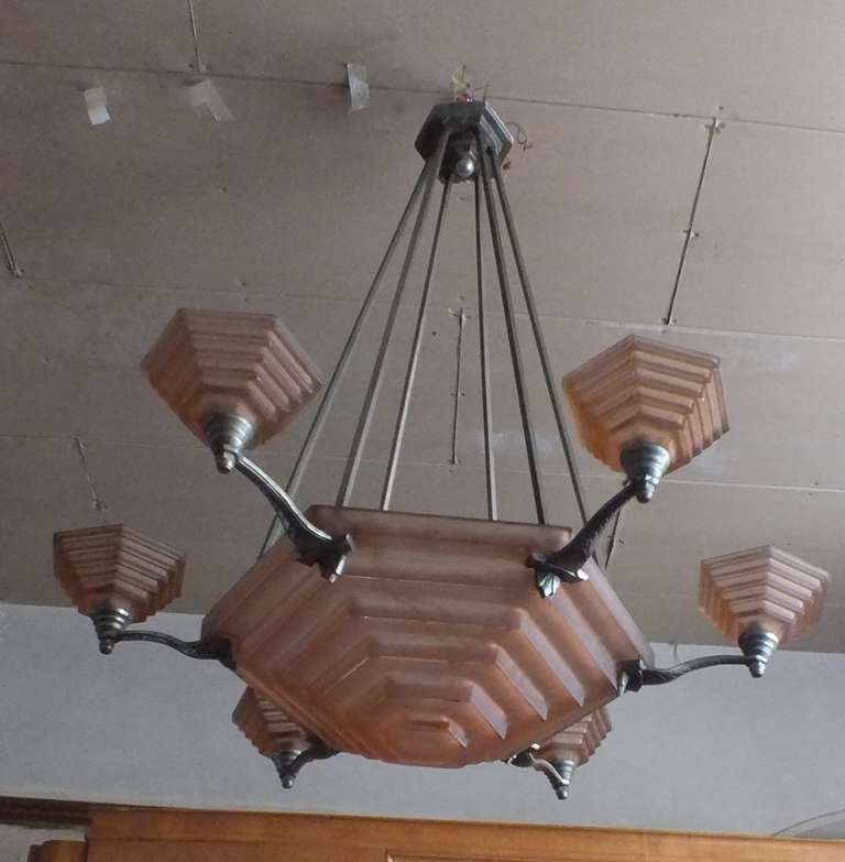 Just when I thought I'd seen them all, this beauty surfaces and I get to buy it.  What an incredible light fixture, even thought  about swapping it with one from my (own deco palace), but my wife says NO!  This is a signed piece!  The weight and