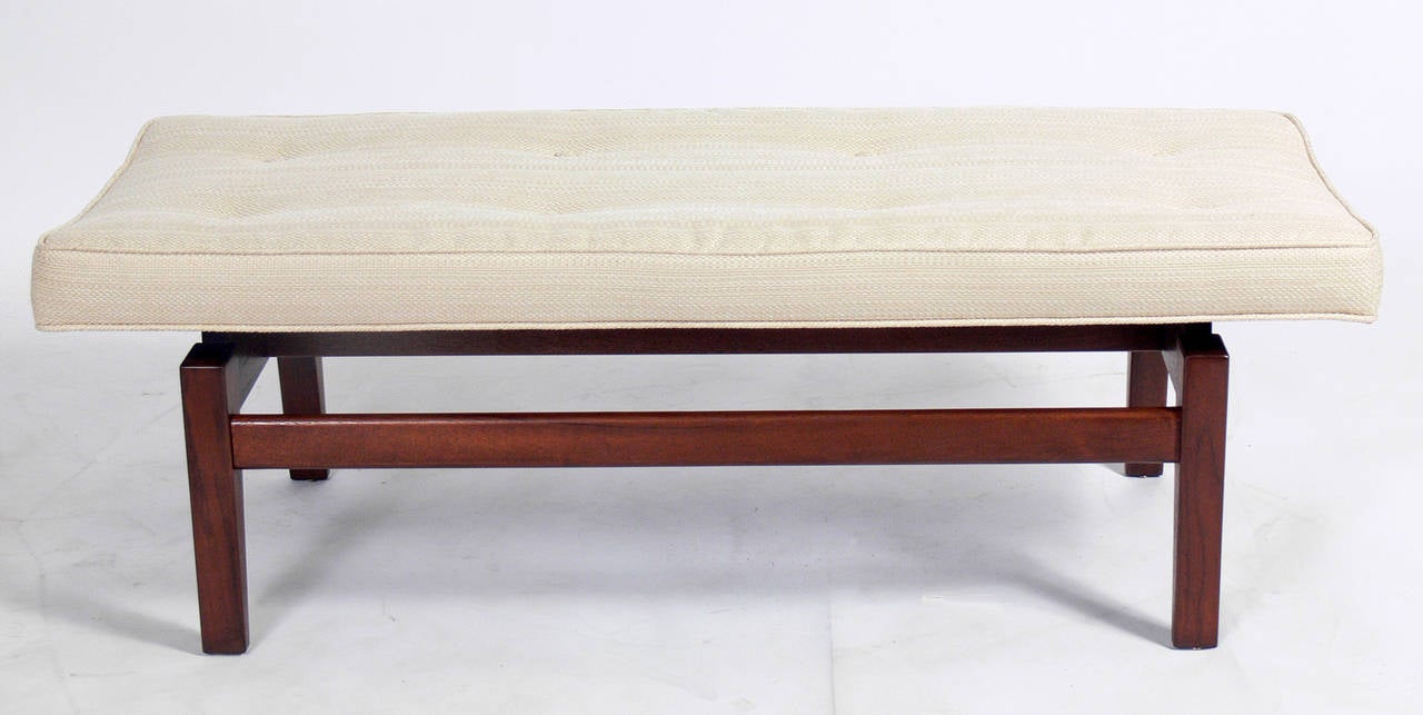 Clean lined modernist bench, designed by Jens Risom, circa 1950's. The simple architectural design appears to float the seat over the base. It is a versatile size and would be perfect at the end of the bed, or as occasional seating in a living area.