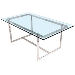 Mesa de comedor o escritorio de cristal y cromo de líneas limpias