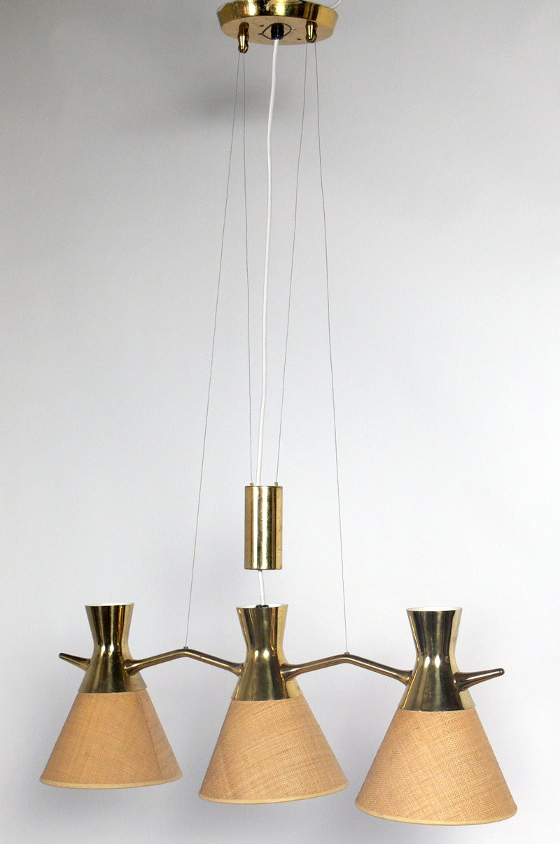 Modern Brass Chandelier or Pendant Light in the manner of Paavo Tynell, probably Finland, circa 1950's. Architectural counterweight design. This piece is a versatile size and would be great over a dining table, kitchen island, or pool table. Retains