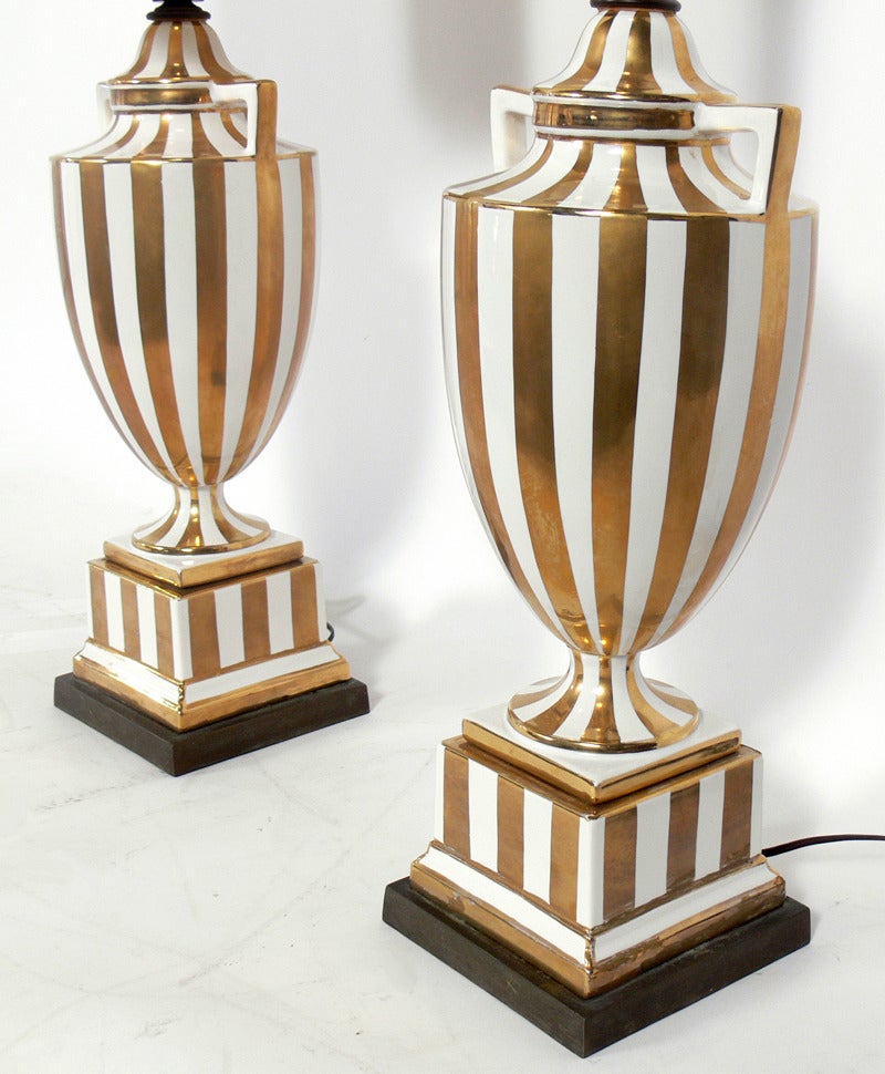 Pair of Gold and White Italian Ceramic Urn Lamps, in the manner of Gio Ponti, circa 1950's. They have been rewired and are ready to use. The price noted below includes the shades.