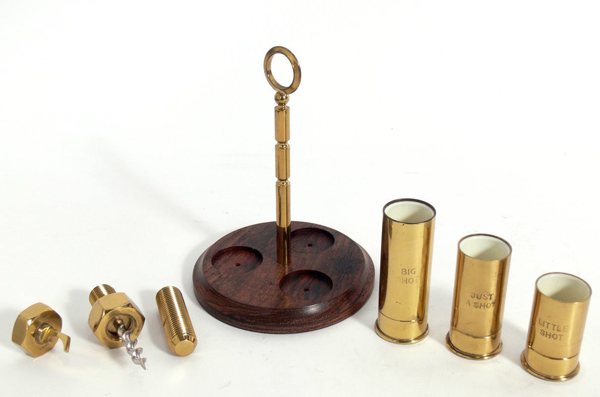 Selection of Art Deco and Mid Century Modern Cocktail and Bar Accessories, circa 1930's-1960's. From left to right, they are: 1) Italian silver plated bottle opener, circa 1960's, it measures 6.25