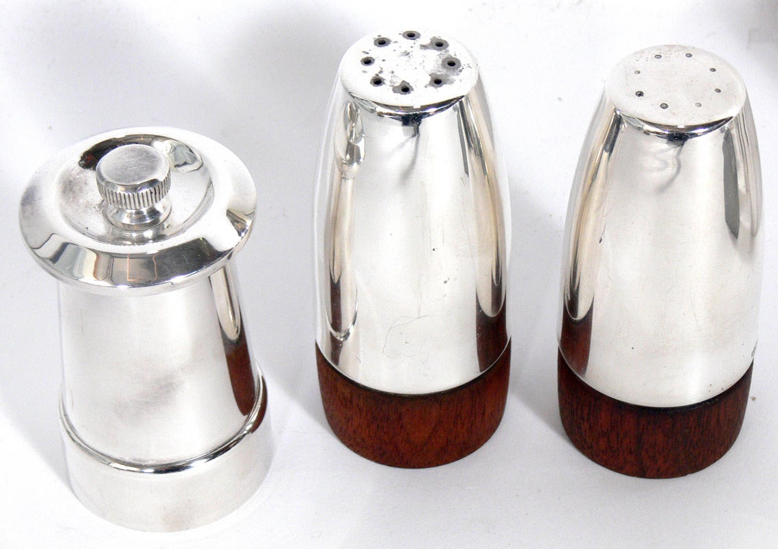 Selection of Modernist Salt and Pepper Shakers, circa 1930's-1950's. From left to right on the top row, they are: 1) Silver plated pepper grinder, designed by Gio Ponti for Krupp, Italy, circa 1950's. It measures 3