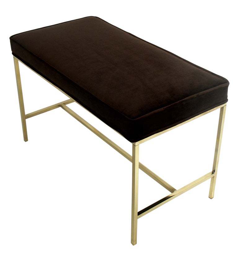 Modernist Brass Bench by Paul McCobb, American, circa 1950's. It has been reupholstered in a deep brown faux velvet and the brass has been hand polished and lacquered.