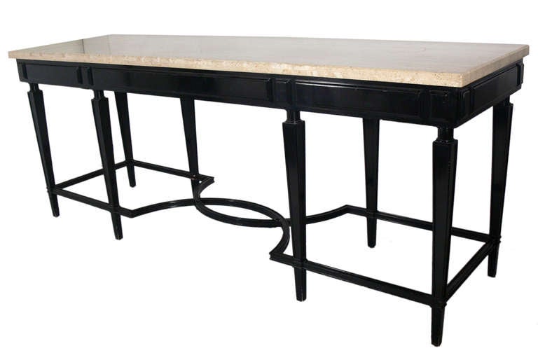 Large Scale Black Lacquer and Travertine Top Console Table. Elegant sculptural base. It is a large scale versatile size, and can be used as a console or entry table, kitchen island or bar. The travertine top is currently finished on three sides, and