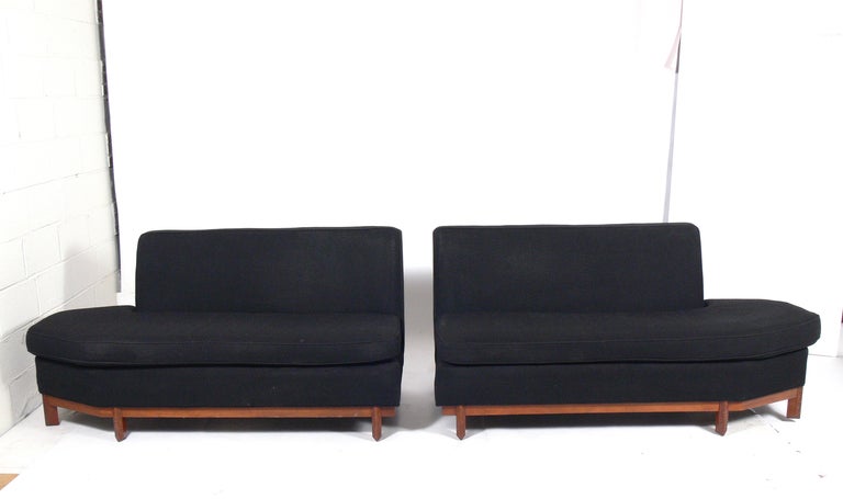 Modernist Two Part Sofa, designed by Frank Lloyd Wright for Heritage Henredon, circa 1950's. This is a versatile piece and can be used as a sofa, sectional, or pair of settees. This piece is currently being refinished and reupholstered. The price