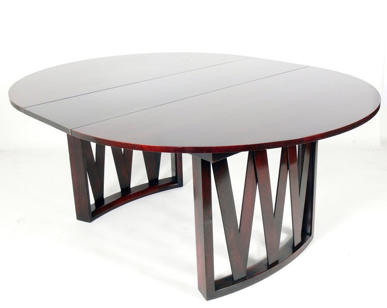 Modern Dining Table, designed by Paul Frankl for Johnson Furniture, American, circa 1950's. It comes with it's original leaf, and when fully expanded, it measures an impressive 68.25