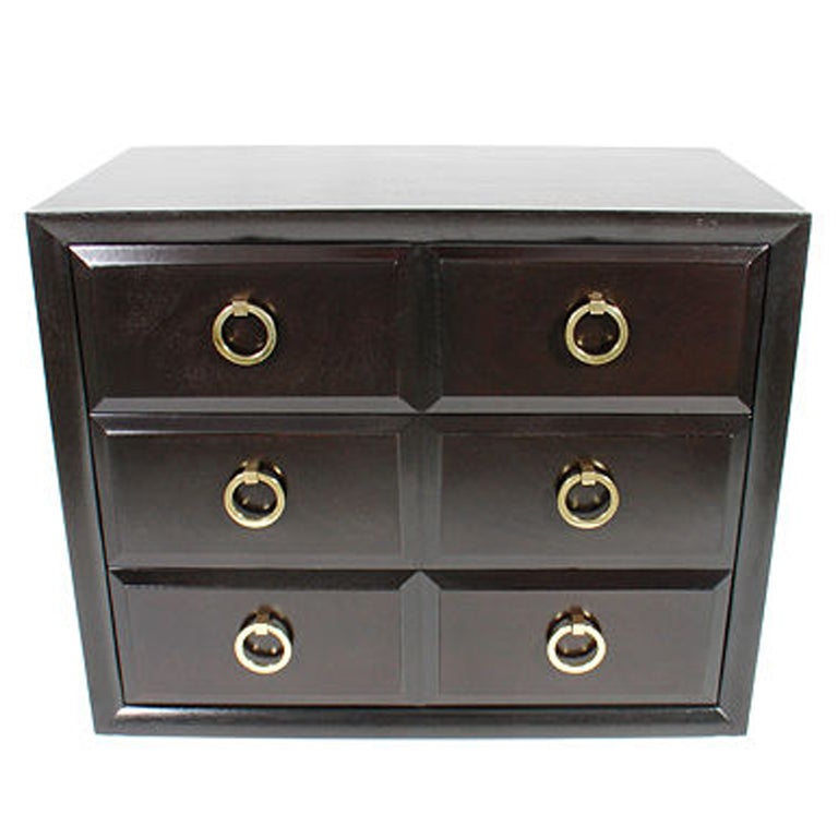 Elegant chest designed by T.H. Robsjohn Gibbings for Widdicomb, circa 1950's. The three drawers open to offer a voluminuous amount of storage. It has been completely restored in an ultra-deep brown lacquered finish with its original brass hardware