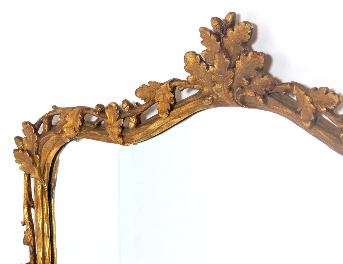 Gilt Oak Leaf Branches Mirror, American, circa 1940's. Wonderful patina to both gilt frame and original mirrored glass.