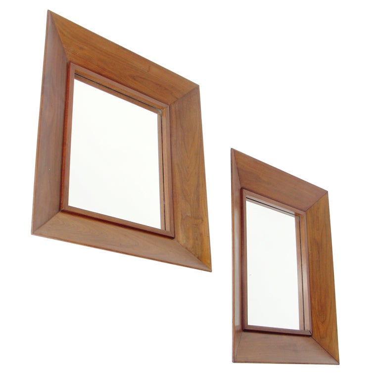 Pair of Deep Profile Modernist Walnut Mirrors, American, circa 1950's. Clean, simple lines with nicely grained walnut. The price noted in this listing is for the pair of mirrors.

Blanket wrap shipping of this piece to most New York City addresses