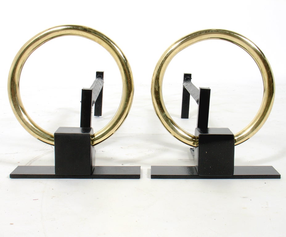 Elegant Modernist Brass Circle Andirons, American, circa 1950's. They have been hand polished and repainted and are ready to use.


Blanket wrap shipping of this piece to most New York City addresses will be approximately $150. Blanket wrap