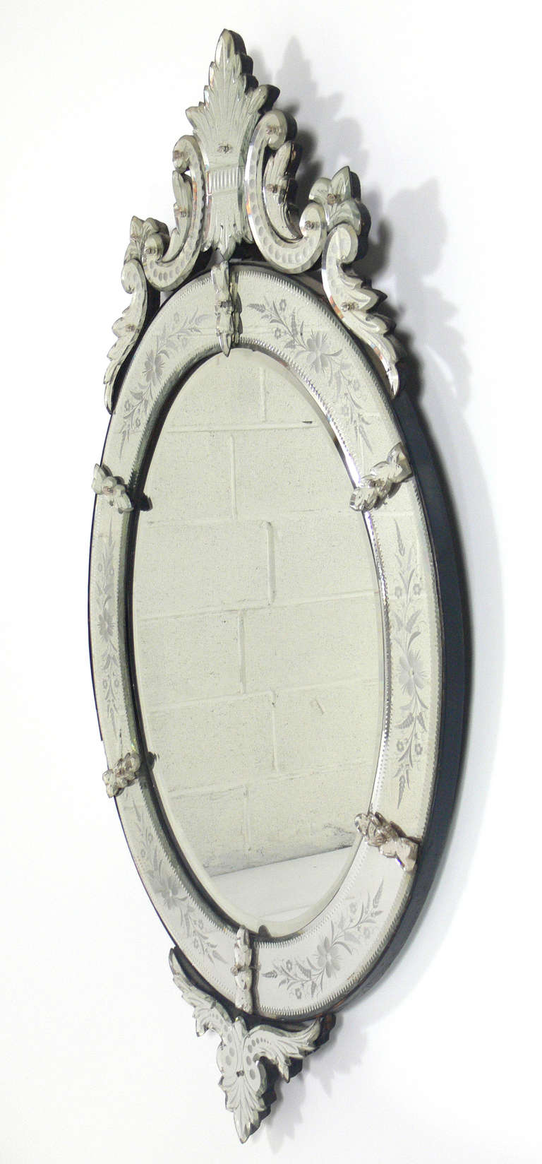 Elegant 19th Century Oval Venetian Mirror, Italy, circa 1890's. Retains wonderful original patina to the mirrored glass.