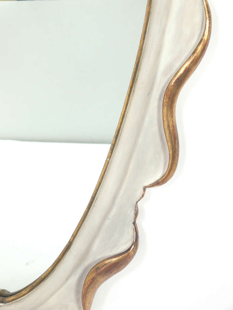 Mid-20th Century Elegant Ivory Color and Gilt Scrolled Mirror in the manner of Dorothy Draper