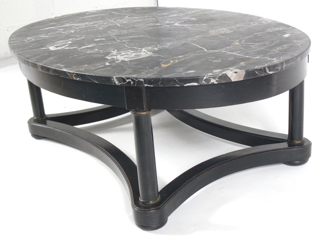 Elegant Oval Marble Top Coffee Table, in the manner of Maison Jansen, circa 1940's. Wonderfully figured black marble top with gray, white, and gold veining.