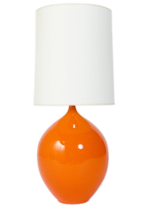 Pair of Vibrant Orange Ceramic Lamps, in the manner of Jacques and Dani Ruelland, circa 1960's. The price noted in this listing is for the pair of lamps and shades.