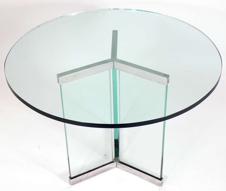 Clean Lined Chrome and Glass Center or Coffee Table, designed by Leon Rosen for Pace, circa 1980's. This table is currently center table height, but if you prefer, we can have the glass center supports cut down to coffee table height at no