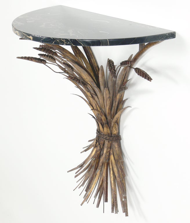 Gilt Metal and Marble Wall Mounted Console Table or Shelf, Italy, circa 1960's. It has a very sculptural form with wonderful original patina to the gilt metal sheaf of wheat. This piece is a versatile size and could be used as a console table,