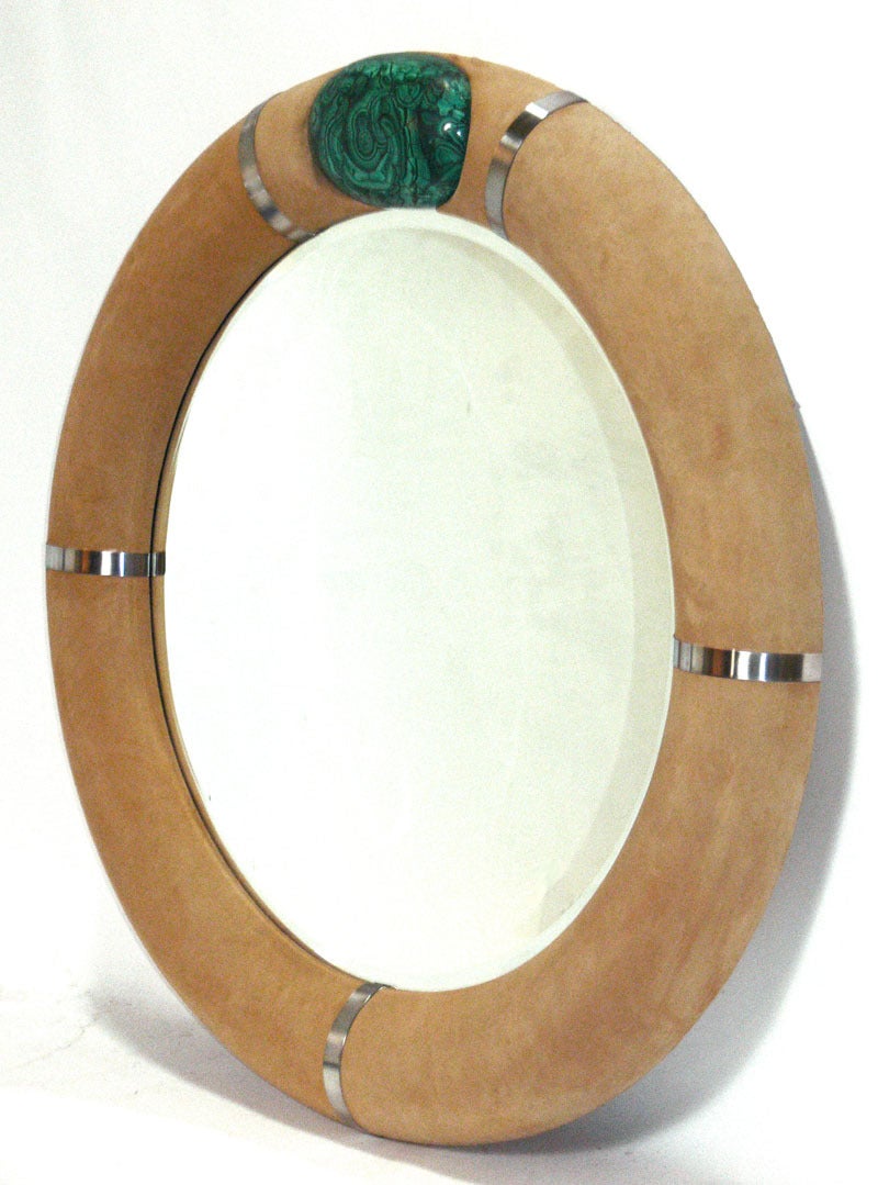 Sculptural Malachite and Suede Mirror, by Gene Jonson and Robert Marcius, circa 1978. 
In 1972, Robert Marcius partnered with Gene Jonson, forming Jonson and Marcius, and moved their business to Manhattan. Throughout the 1970's and early 80's, they