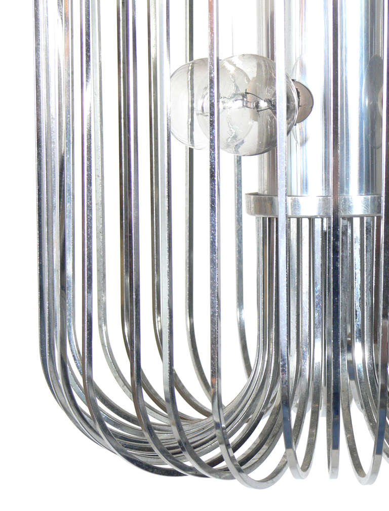 Modernist Chrome Chandelier or Pendant Lamp by Lightolier, circa 1960's. This piece is a versatile size and can be used as a chandelier, or as a pendant light or fixture. Sculptural modern form.