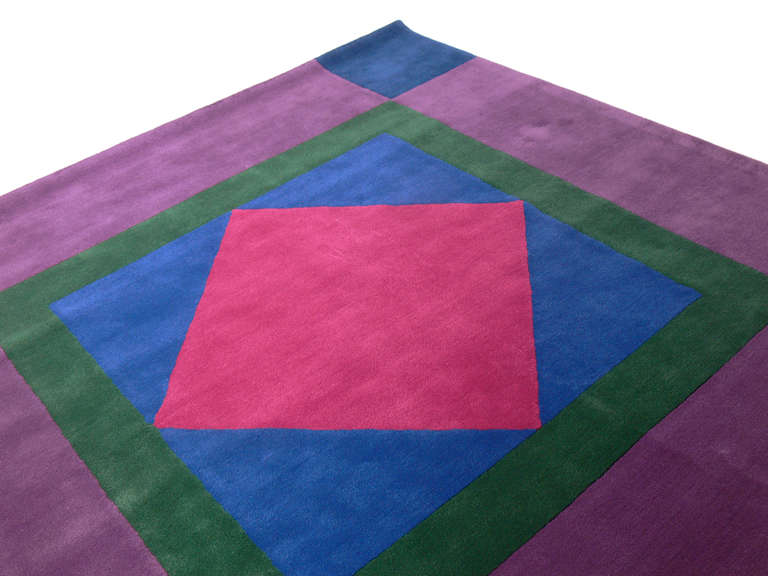 Vibrant modern wool rug, designed by The Edward Fields Company, American, circa 1970's. This piece was still in it's original manufacturer's wrapper when we purchased it. See photos below. It has literally never been used.