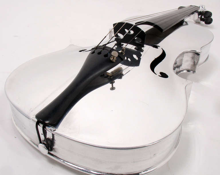 Aluminum Violin, designed by John Burdick for the Aluminum Company of America (ALCOA), circa 1930. An incredibly sculptural and emblematic icon of the Machine Age. The Aluminum Company of America (ALCOA) first produced John Burdick’s full size