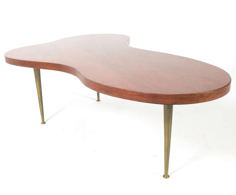 Biomorphic Coffee Table, designed by T.H. Robsjohn Gibbings for Widdicomb, circa 1950's. Sculptural walnut top with sleek brass legs.

Blanket wrap shipping of this piece to most New York City addresses will be approximately $300. Blanket wrap