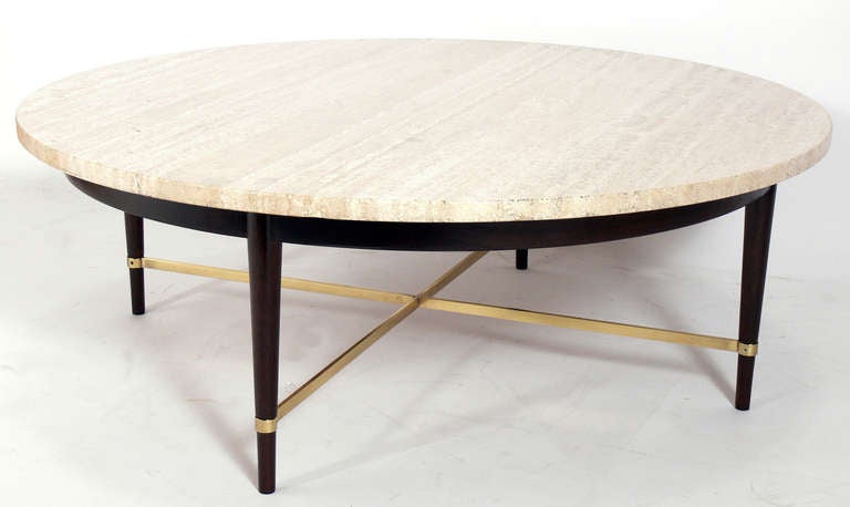 Round Travertine and Brass Coffee Table, designed by Paul McCobb, circa 1950's. The wood base has been refinished in an ultra deep brown, and the brass has been hand polished and lacquered.