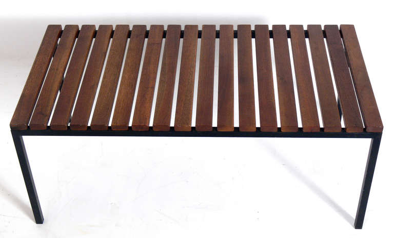 Clean Lined Walnut and Iron Slat Bench by Knoll, circa 1960's. This piece is a versatile size and can be used as a bench or coffee table.