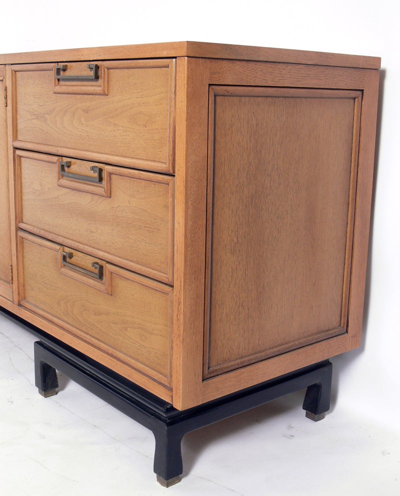 Asian Influenced Chest, American, circa 1960's. This piece is a versatile size and can be used as credenza, bar, or media cabinet in a living area, or as a dresser or chest in a bedroom. It is currently being refinished, and can be completed in your