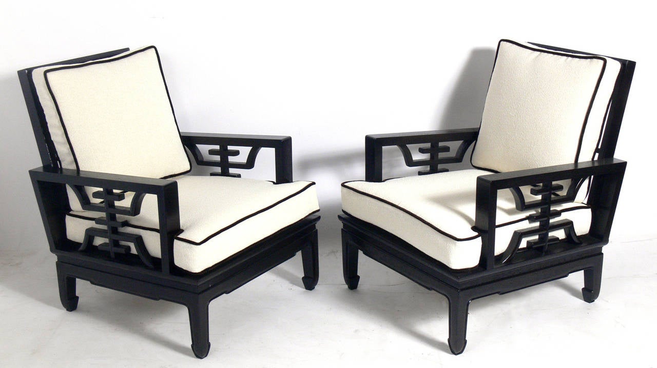 Pair of Chinese Art Deco lounge chairs, China, circa 1930s. They have been completely restored in an ultra-deep brown lacquer with ivory bouclé upholstery with dark brown velvet piping.