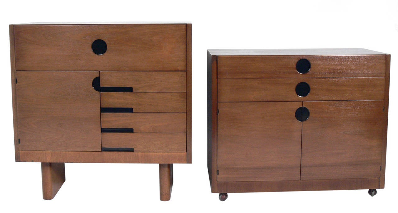 Pair of Art Deco Cabinets, designed by Gilbert Rohde for Herman Miller, circa 1930's. They are a versatile size and can be used as a credenza, cabinet, bar, dresser, or bookshelf. The piece pictured on the left measures 37