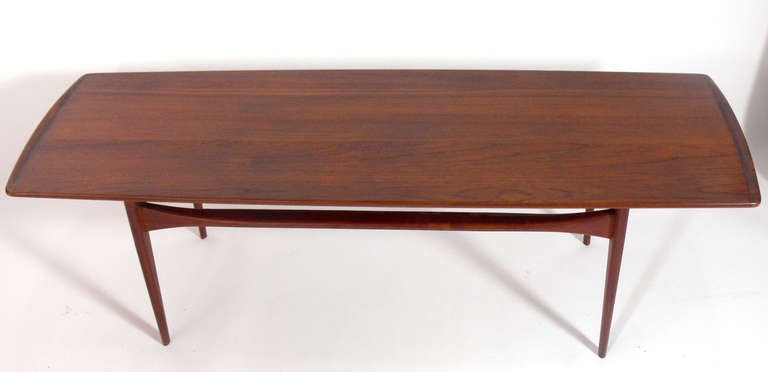 Danish Modern Coffee Table, designed by Tove & Edvard Kindt-Larsen for France and Sons, Denmark, circa 1960's. Sleek rectangular form with sculptural shaped ends.